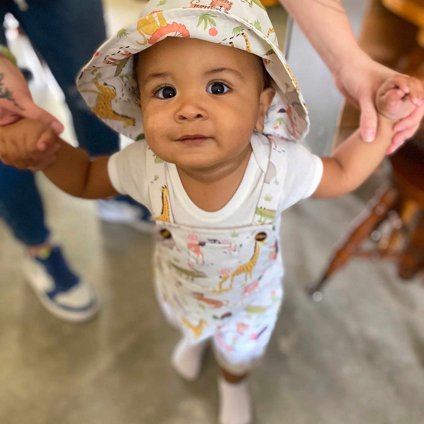 Josiah is registered to the contest to win money with this photo: baby, bodypart, bonnet, clothing, face, finger, footwear, hand, happy, hat, head, hosiery, pants, person, photography, portrait, shoe, smile, sock, sunhat