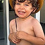 boy, child, cowboy_hat, curly_hair, cute, door, face, glass_door, hand, happy, hat, indoors, joyful, playful, portrait, shirtless, skin, smiling, teeth, young
