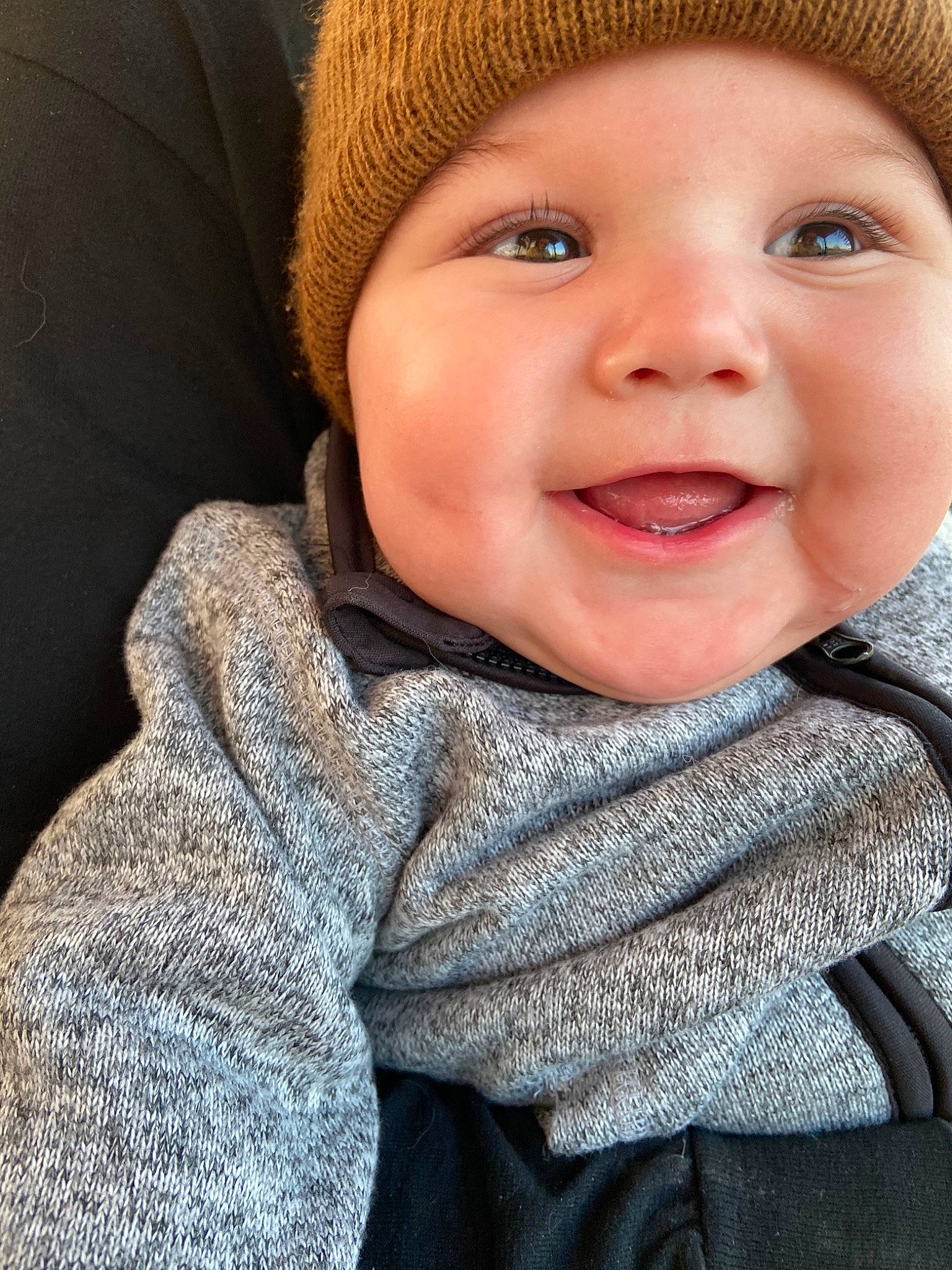 Monroe is registered to the contest to win money with this photo: baby, cheek, child, child_model, chin, close_up, eye, face, facial_expression, head, headgear, headwear, joy, knit_cap, laugh, lip, mouth, nose, person, portrait_photography