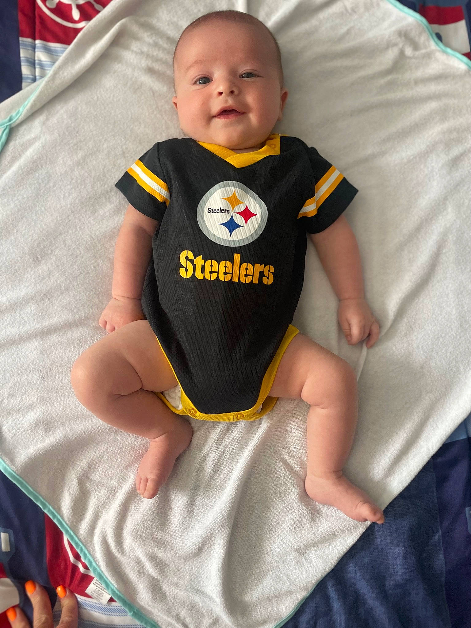 Nico is registered to the contest to win money with this photo: baby, baby_products, baby_safety, baby_toddler_clothing, bib, cheek, child, comfort, eye, happy, head, infant_bodysuit, linens, orange, person, sleeve, smile, sportswear, t_shirt, toddler