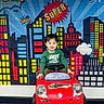 Bryan Matheus is registered to the contest to win money with this photo: child, toy_car, red, green_shirt, indoor, comic_background, cityscape, colorful, flooring, hair, smiling, playful, young_child, seat, furniture, wall_art, happy, person, portrait, light
