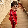 Bryan Matheus joined the competition — help win amazing prizes! toddler, child, red_tracksuit, porch, wooden_floor, autumn_leaves, fall, outdoor, smiling, side_profile, casual_clothing, sneakers, young_child, seasonal, daylight, window, railing, nature, cute, happy