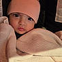 Ansley is registered to the contest to win money with this photo: baby, infant, face, pink_hat, blanket, car_seat, child, cute, wide_eyes, close_up, warm_clothing, newborn, portrait, cozy, indoors, soft_texture, wrapped, looking_at_camera, adorable, peaceful