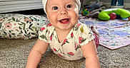 Raleigh joined the competition — help win amazing prizes! baby, child, crawling, carpet, bow, headband, smiling, happy, nursery, crib, toy, floor, indoor, person, cute, infant, clothing, pink, playmat, home