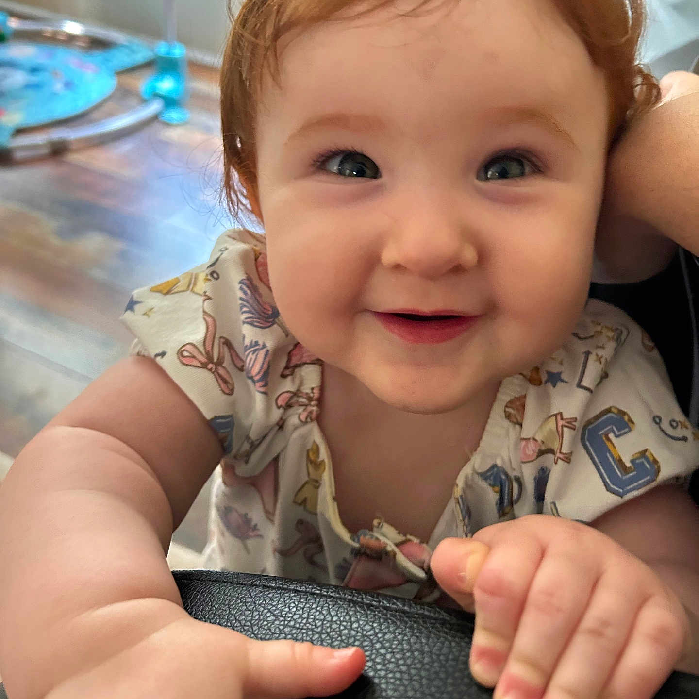 Delilah joined the competition — help win amazing prizes! baby, child, curly_hair, red_hair, smiling, happy, indoor, closeup, face, hand, cute, curiosity, portrait, infant, skin, person, clothing, playful, young, expression