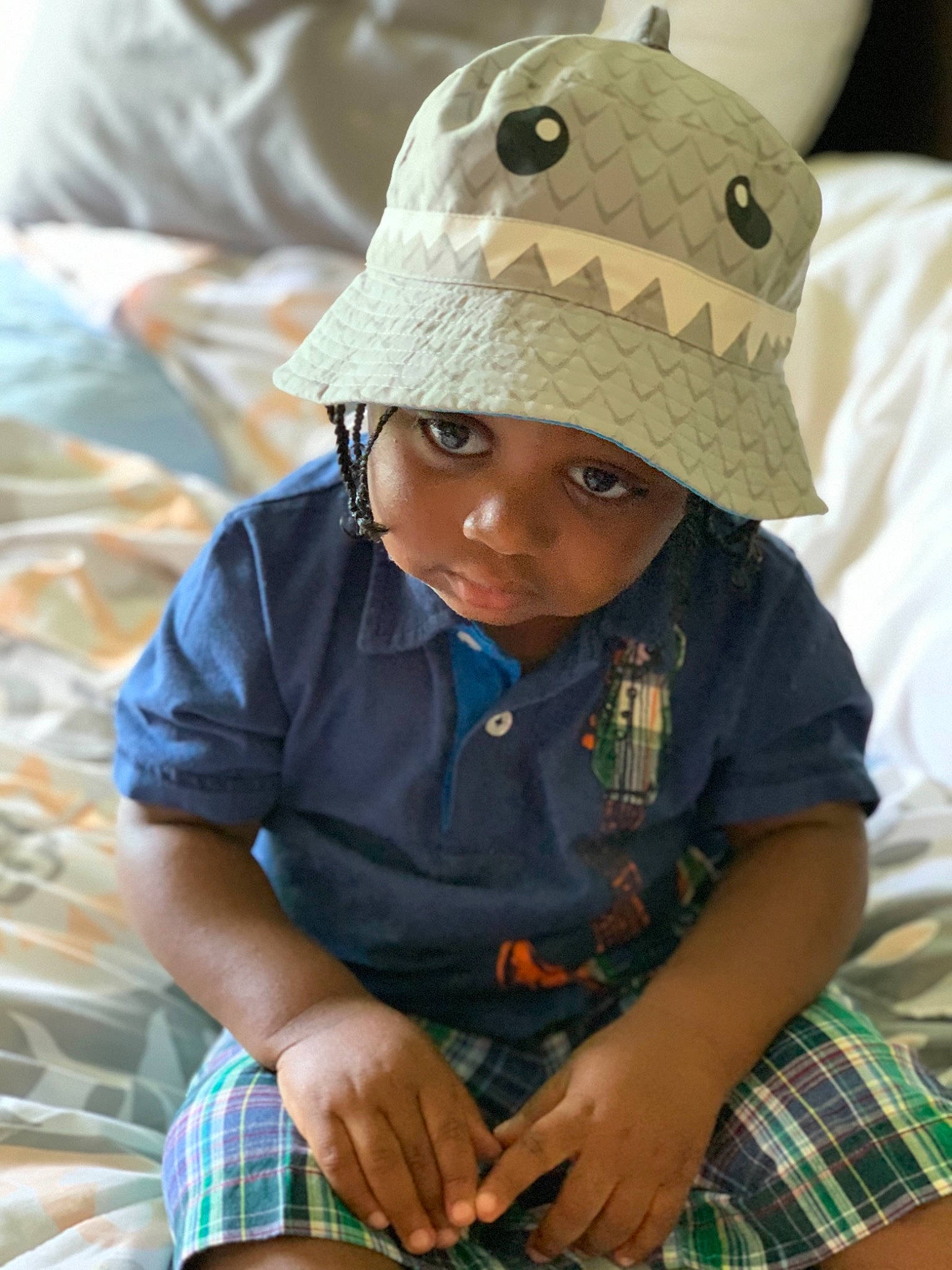 Dione joined the competition — help win amazing prizes! adaptation, baby_toddler_clothing, baseball_cap, cap, child, fun, green, happy, headgear, headwear, helmet, outerwear, pattern, person, plaid, sitting, skin, sleeve, smile, tartan