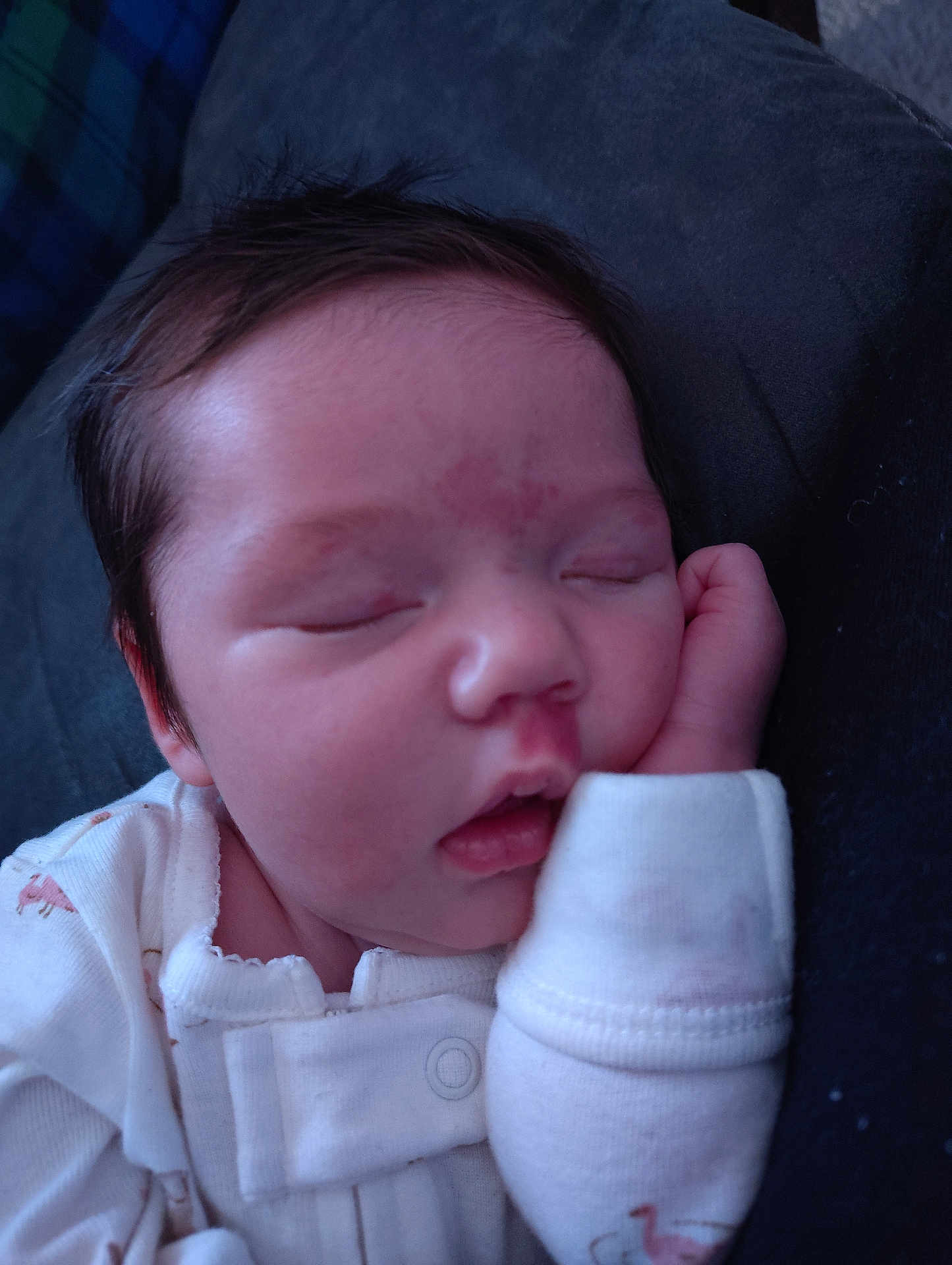 E'Milia is registered to the contest to win money with this photo: baby, newborn, sleeping, face, closed_eyes, onesie, hand, cheek, hair, infant, portrait, peaceful, skin, mouth, nose, eyelids, pajamas, bed, blanket, cuddled