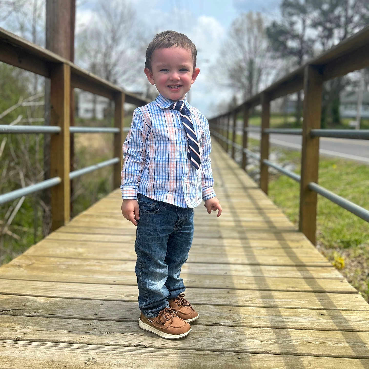 Hayden joined the competition — help win amazing prizes! boy, child, clothing, face, footwear, grass, head, jeans, male, pants, path, person, photography, plant, portrait, shoe, walking, water, waterfront, wood