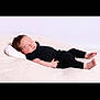 Zéphyr participe au concours pour gagner de l'argent avec cette photo : baby, black_clothing, calm, child, cozy, cute, indoors, infant, lying_down, newborn, peaceful, pillow, portrait, relaxing, resting, sleeping, small_hands, soft_texture, tiny_feet, white_background