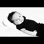 Zéphyr a rejoint le concours — aidez-le/la à gagner de superbes lots ! baby, black_and_white, calm, clothing, cute, face, head, indoors, infant, lying_down, monochrome, newborn, person, pillow, portrait, relaxation, sleepy, small, soft_texture, young_child