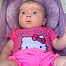 Milly is registered to the contest to win money with this photo: baby, infant, child, pink_clothing, hello_kitty, car_seat, purple, cushion, wide_eyes, curious_expression, foot, seatbelt, indoors, cute, young_child, person, portrait, sitting, clothing, head