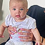 Alba a rejoint le concours — aidez-le/la à gagner de superbes lots ! baby, infant, child, person, blue_eyes, white_shirt, white_pants, sitting, couch, hand, manicure, pink_nails, adult, indoor, portrait, cute, looking_at_camera, expression, skin, holding