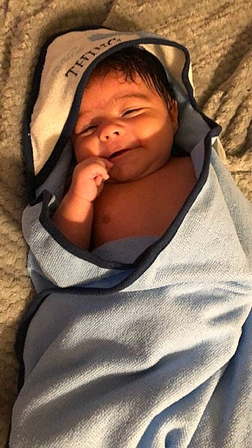 Gael is registered to the contest to win money with this photo: baby, baby_products, baby_sleeping, baby_toddler_clothing, blanket, cheek, child, comfort, hood, hoodie, linens, nap, person, skin, sleep, sweatshirt, toddler