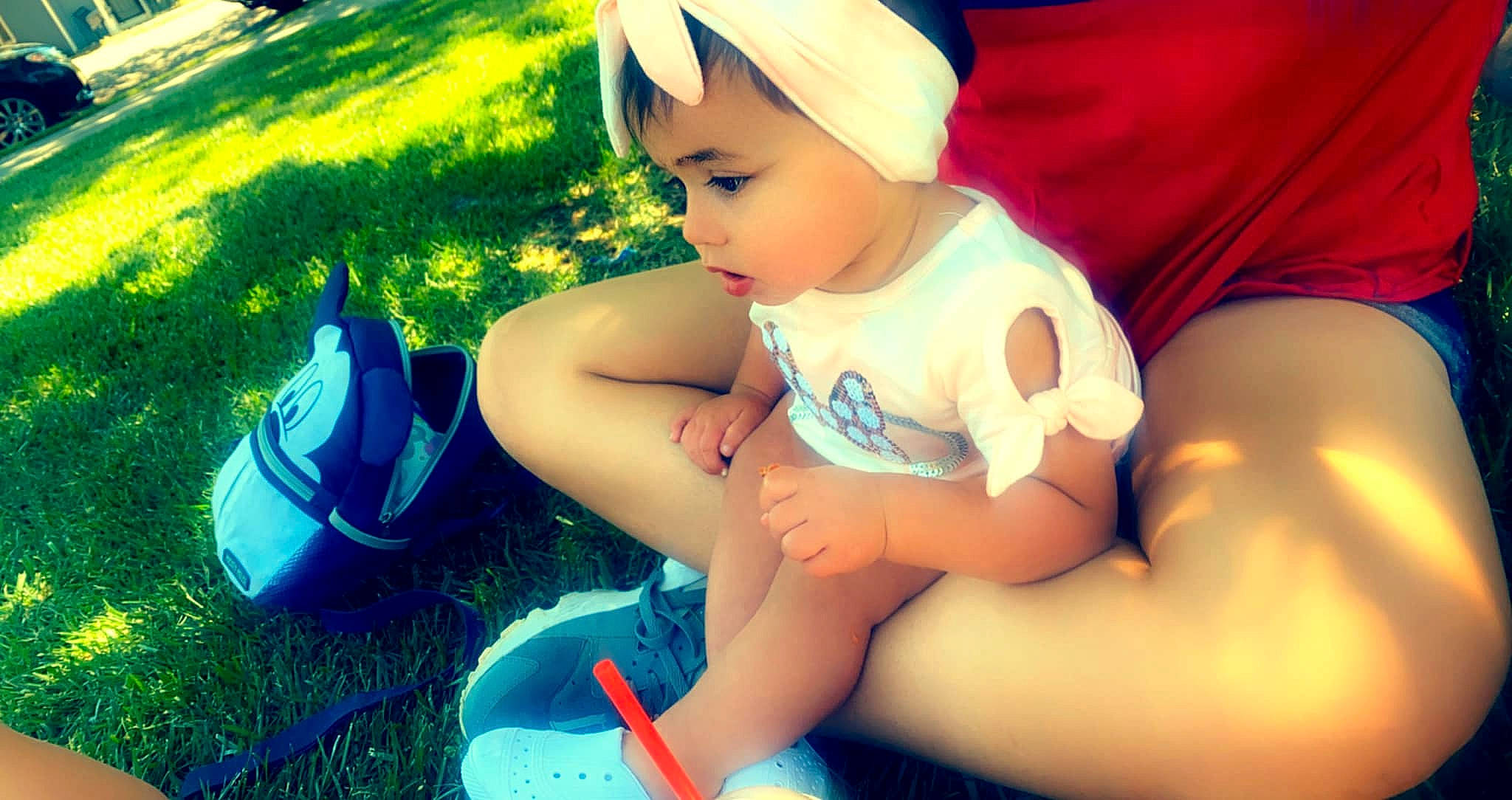 Ellyana is registered to the contest to win money with this photo: baby, baby_toddler_clothing, child, cool, electric_blue, facial_expression, fun, grass, green, happy, headgear, human_leg, knee, leg, leisure, people_in_nature, person, plant, summer, thigh