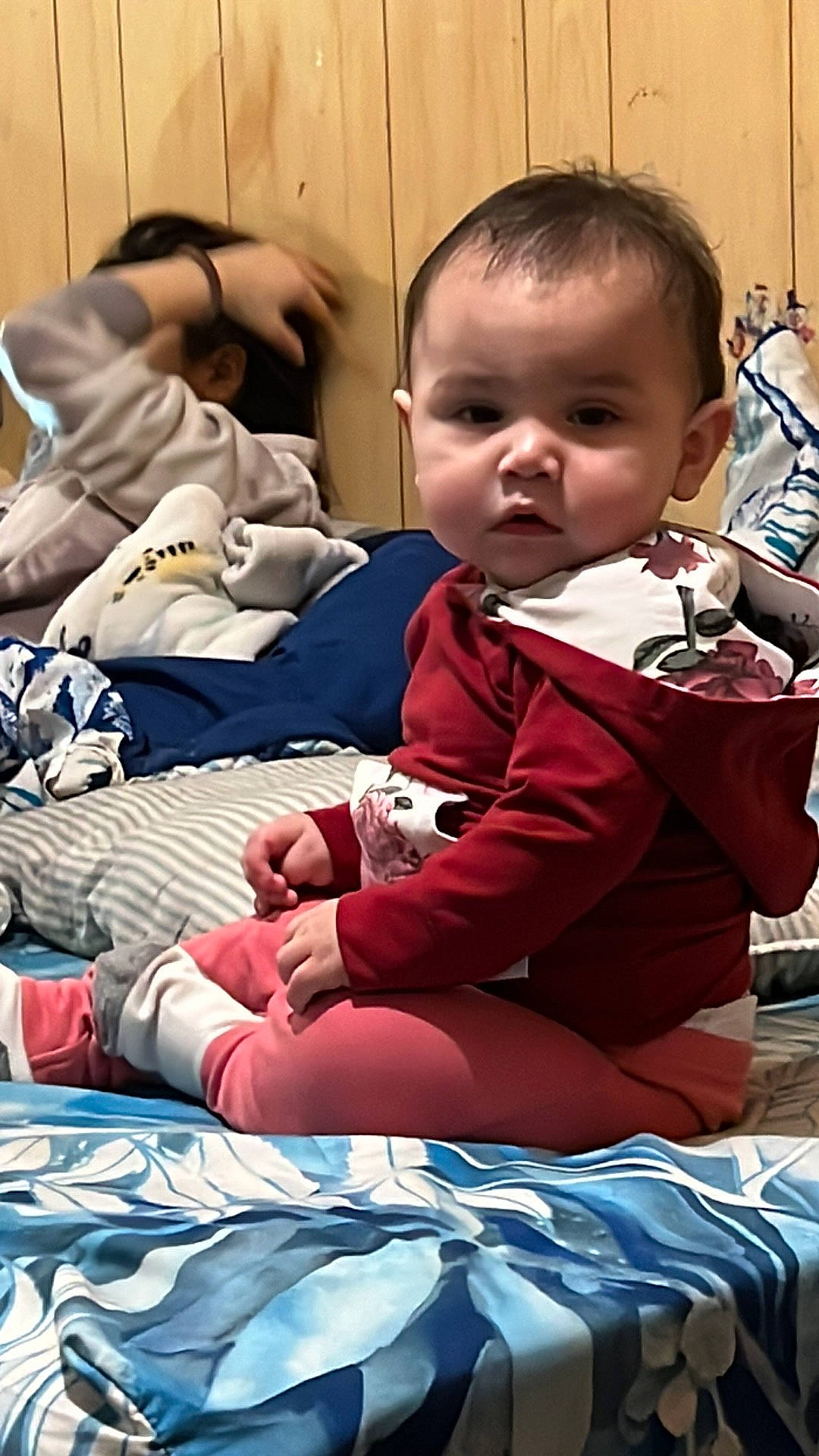 Addison is registered to the contest to win money with this photo: baby, baby_toddler_clothing, carmine, cheek, child, christmas, comfort, event, fun, happy, holiday, lap, leisure, linens, luggage_and_bags, person, play, room, sitting, toddler