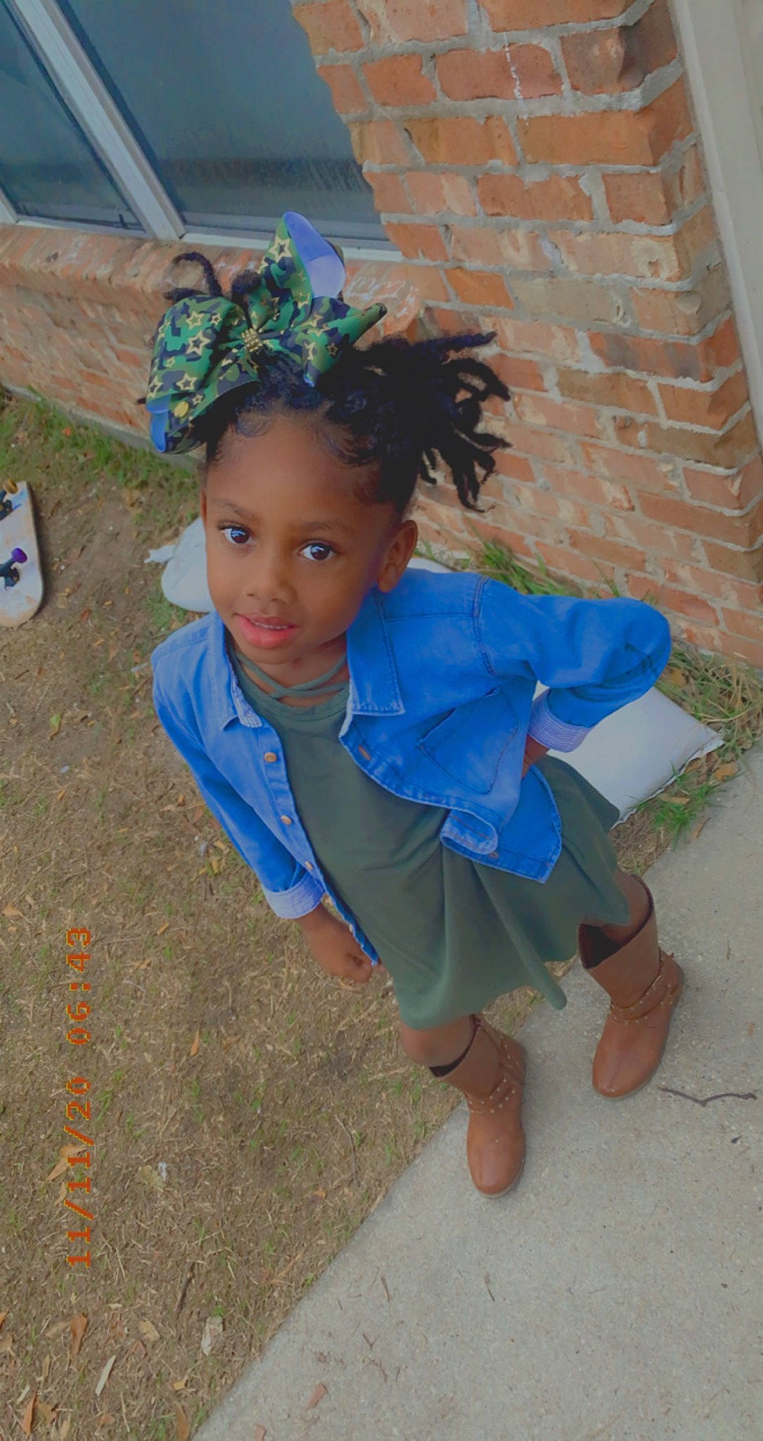 Aubrielle is registered to the contest to win money with this photo: azure, barefoot, blue, child, chin, costume, electric_blue, event, flooring, foot, fun, grass, happy, human_leg, jewellery, leisure, person, sandal, sitting, toddler