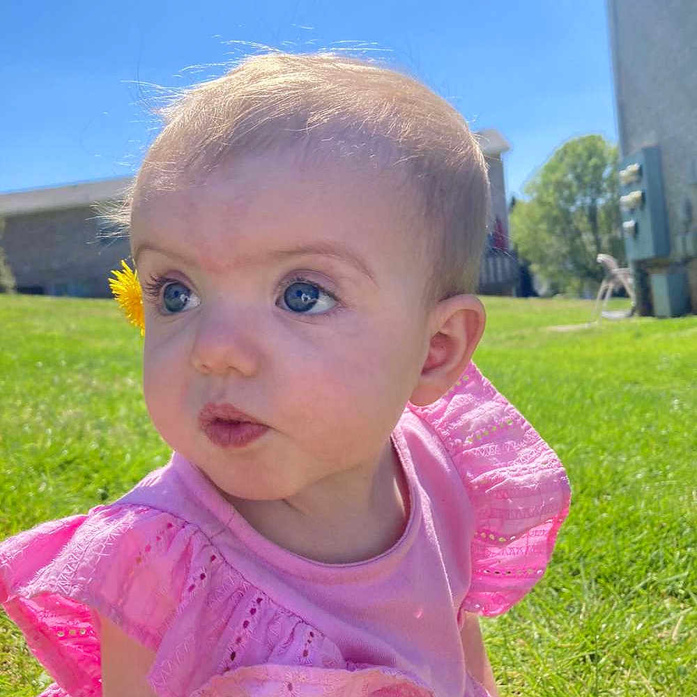 Iris joined the competition — help win amazing prizes! baby, backyard, clothing, dress, face, flower, grass, hair, head, lawn, nature, outdoors, person, petal, photography, plant, portrait, summer, t_shirt, yard