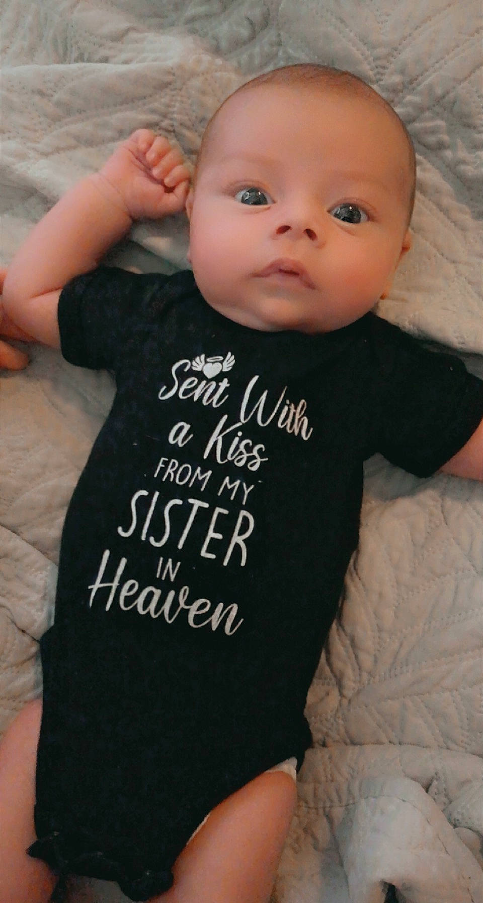 Ares is registered to the contest to win money with this photo: baby_toddler_clothing, cheek, chin, eye, eyebrow, face, facial_expression, gesture, grey, hairstyle, head, iris, lip, mouth, neck, nose, person, skin, sleeve, standing