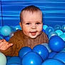 Oakley joined the competition — help win amazing prizes! baby, ball, balloon, bodypart, face, finger, hand, happy, head, indoors, laughing, mouth, person, photography, playarea, portrait, sitting, smile, sphere, teeth