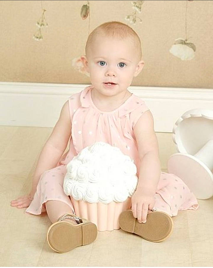 Willow joined the competition — help win amazing prizes! baby, baby_products, baby_toddler_clothing, child, child_model, dress, fashion_accessory, footwear, person, pink, product, room, ruffle, shoe, sitting, sleeve, toddler, white