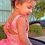 Ayla joined the competition — help win amazing prizes! toddler, child, curly_hair, pink_dress, tutu, smiling, outdoor, stroller, greenery, sunlight, earrings, side_profile, happy, person, baby, summer, playful, cute, portrait, daylight