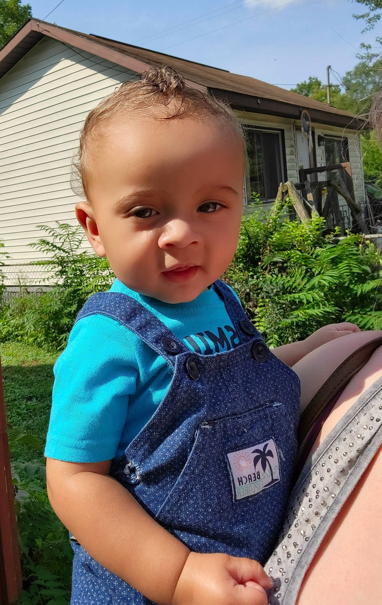 Tayden is registered to the contest to win money with this photo: baby, baby_toddler_clothing, child, electric_blue, grass, happy, house, iris, leaf, leisure, pattern, person, plant, sitting, skin, sky, sleeve, t_shirt, toddler, tree