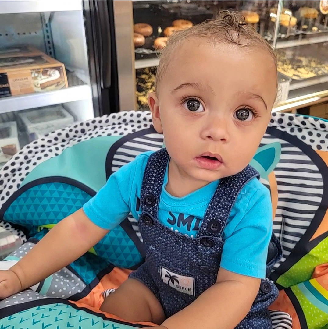 Tayden joined the competition — help win amazing prizes! baby, baby_toddler_clothing, blue, chair, child, electric_blue, fun, hairstyle, happy, human_leg, iris, leisure, pattern, person, selfie, shelf, sitting, sleeve, t_shirt, thigh