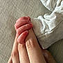 Marceau participe au concours pour gagner de l'argent avec cette photo : baby_hand, adult_finger, skin, grip, touch, connection, tenderness, newborn, infant, clothing, fabric, closeup, human, fingers, nail, wrinkle, soft_light, background, texture, intimacy
