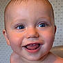 baby, child, smile, face, blue_eyes, wet_skin, teeth, tongue, close_up, portrait, cute, infant, happy, skin, head, expression, person, indoors, background, joy