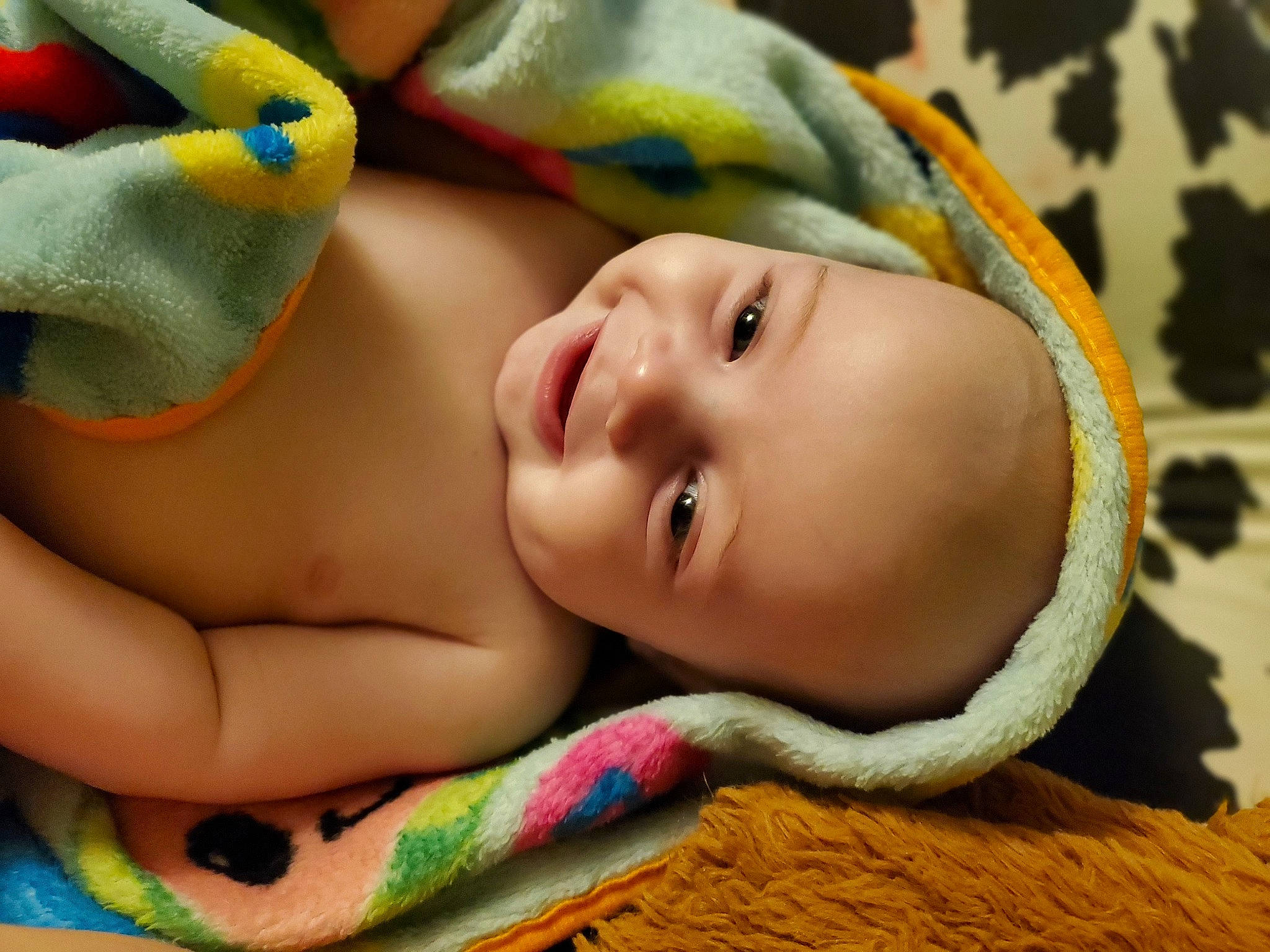 Christian Vallee is registered to the contest to win money with this photo: abdomen, baby, baby_products, baby_toddler_clothing, cheek, child, comfort, fashion_accessory, fun, happy, headgear, iris, linens, mouth, nose, person, skin, smile, toddler, tummy_time