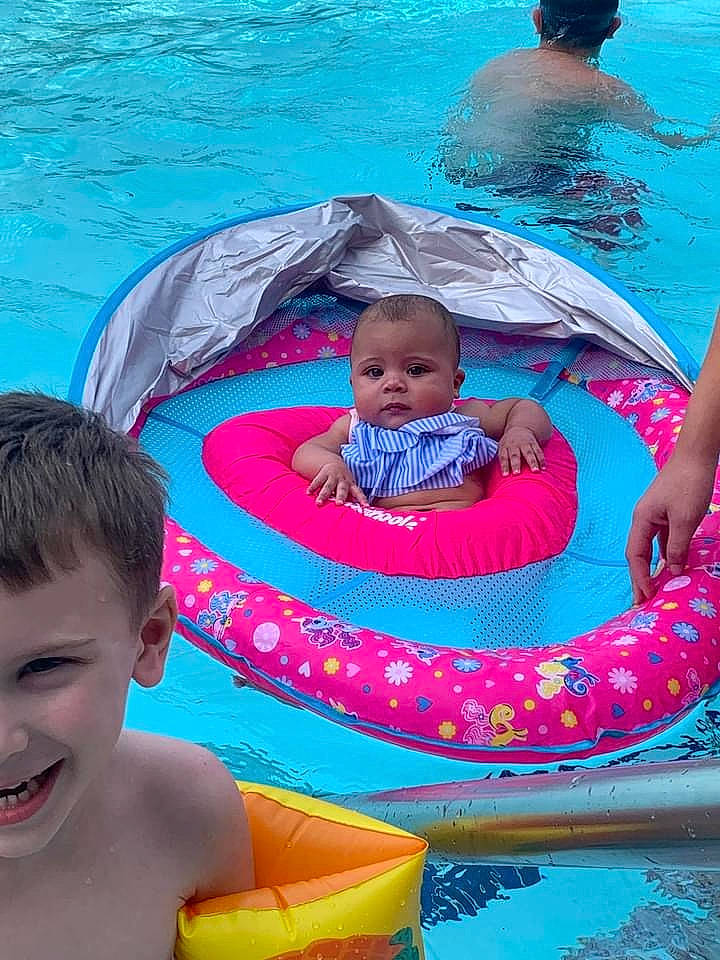 Patience joined the competition — help win amazing prizes! aqua, azure, baby, baby_float, blue, face, fun, happy, head, joy, leisure, organ, outdoor_recreation, person, photograph, product, recreation, red, smile, swimming_pool