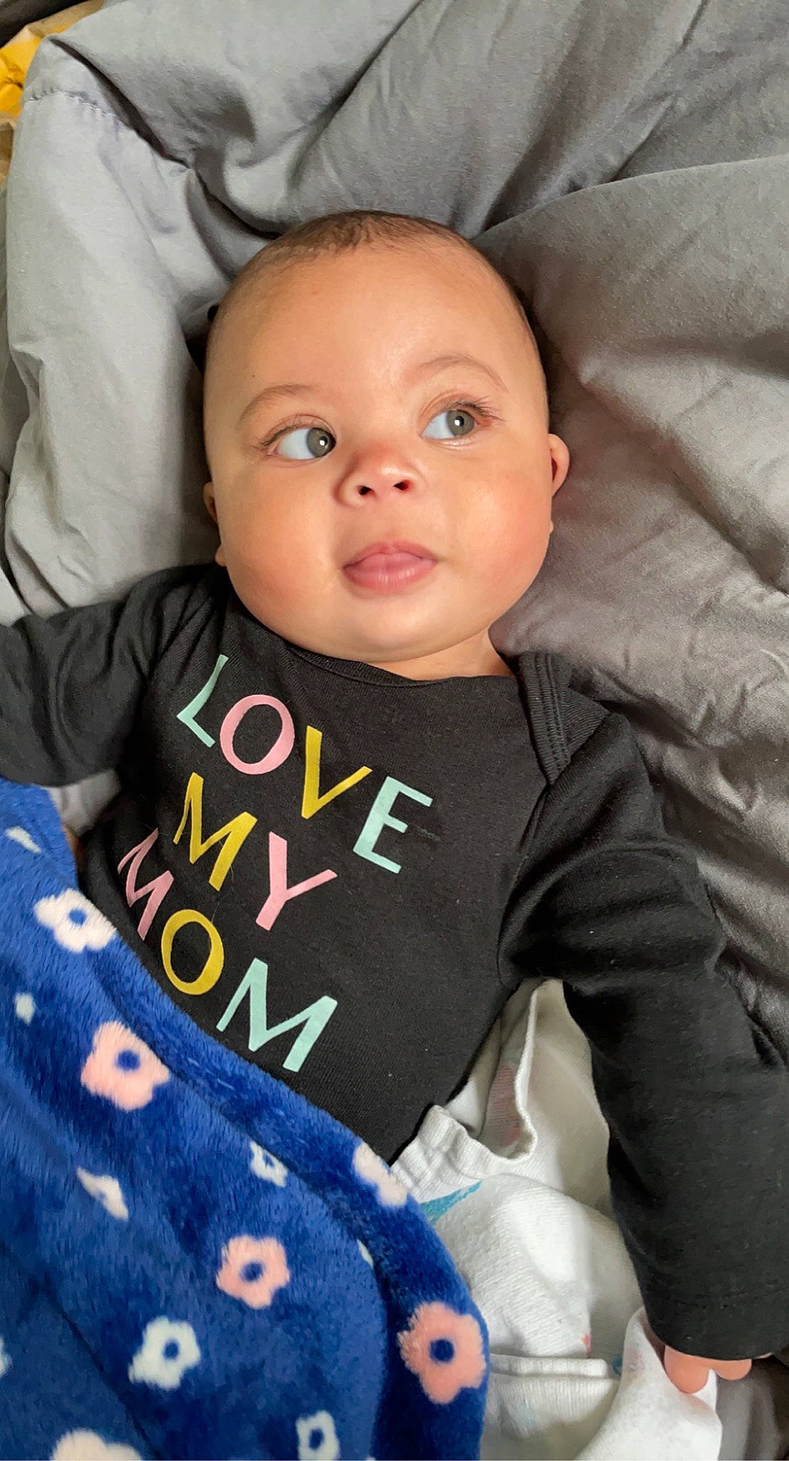 Patience is registered to the contest to win money with this photo: arm, baby, baby_toddler_clothing, cheek, chin, comfort, cool, eye, eyebrow, facial_expression, finger, hairstyle, iris, nose, outerwear, person, skin, sleeve, smile, t_shirt