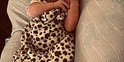 Haizly joined the competition — help win amazing prizes! baby, sleeping, infant, headband, bow, leopard_print, dress, clothing, cushion, soft_texture, cozy, peaceful, cute, child, newborn, person, resting, skin, foot, hand