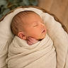 Jagger is registered to the contest to win money with this photo: newborn, baby, sleeping, wrapped, blanket, basket, cozy, soft, face, peaceful, infant, cute, portrait, warm, wooden_floor, greenery, indoors, child, resting, skin