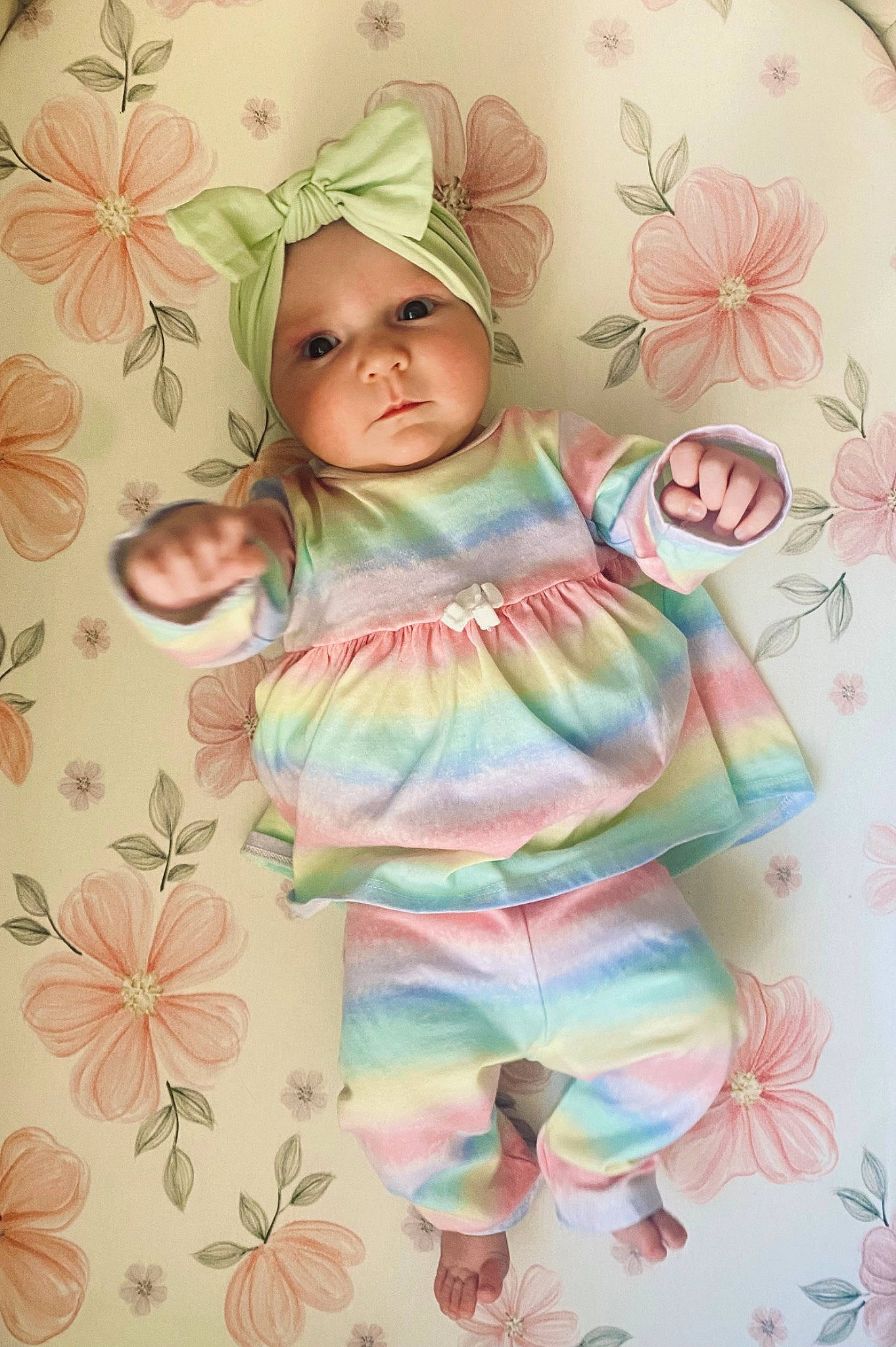 Bristol is registered to the contest to win money with this photo: baby, baby_toddler_clothing, cheek, child, design, happy, headwear, leaf, linens, magenta, pattern, peach, person, petal, pink, room, sleeve, textile, toddler, visual_arts