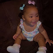 Emyla joined the competition — help win amazing prizes! apparel, baby, child, clothing, couch, cute, fun, girl, hair_bows, happy, indoor, joy, leather, person, seat, sitting, smile, toddler, white_shoes, young_child