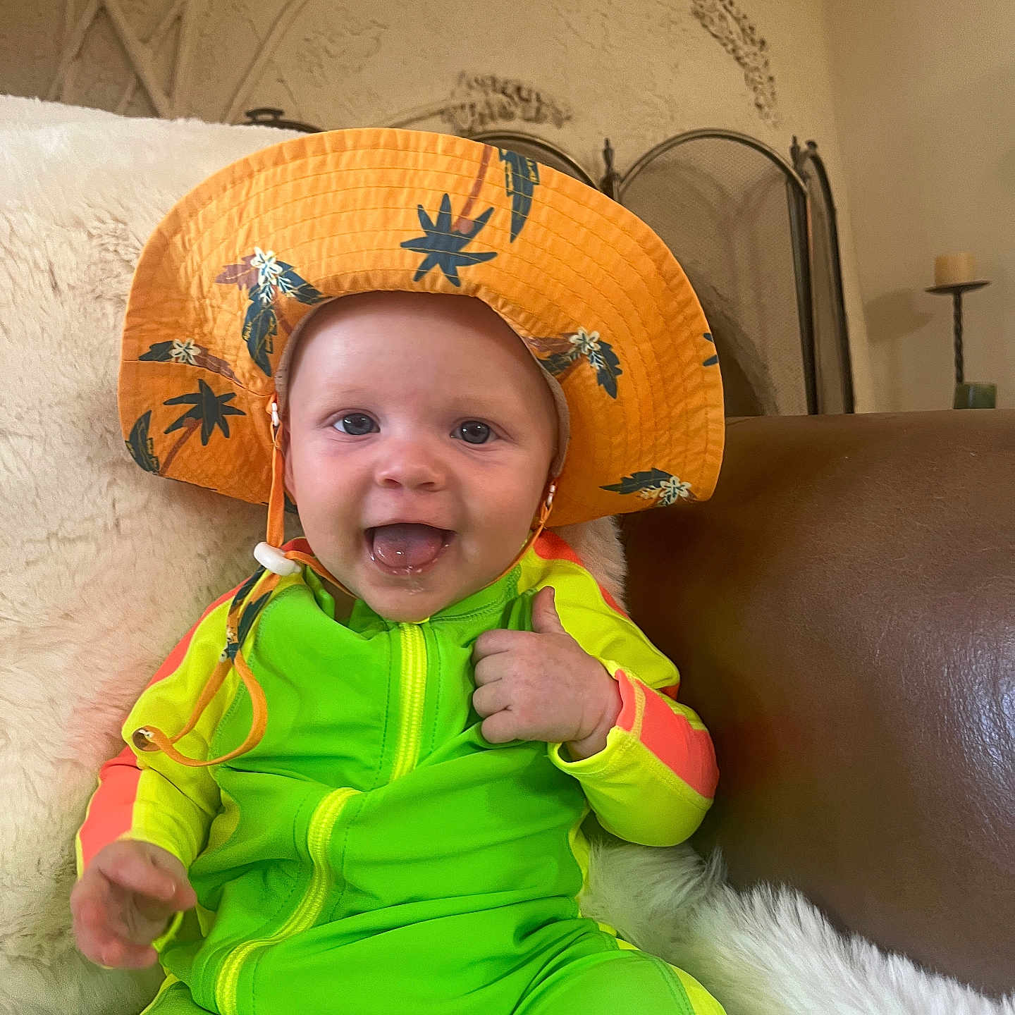 Ryker joined the competition — help win amazing prizes! architecture, baby, bodypart, bonnet, building, candle, cap, clothing, couch, face, finger, furniture, hand, hat, head, person, photography, portrait, sitting, sunhat