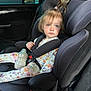 toddler, child, car_seat, baby_bottle, blue_eyes, floral_onesie, ponytail, car_interior, seatbelt, child_safety, curious_expression, daylight, cute, young_child, infant, seat, baby, person, transportation, casual_clothing