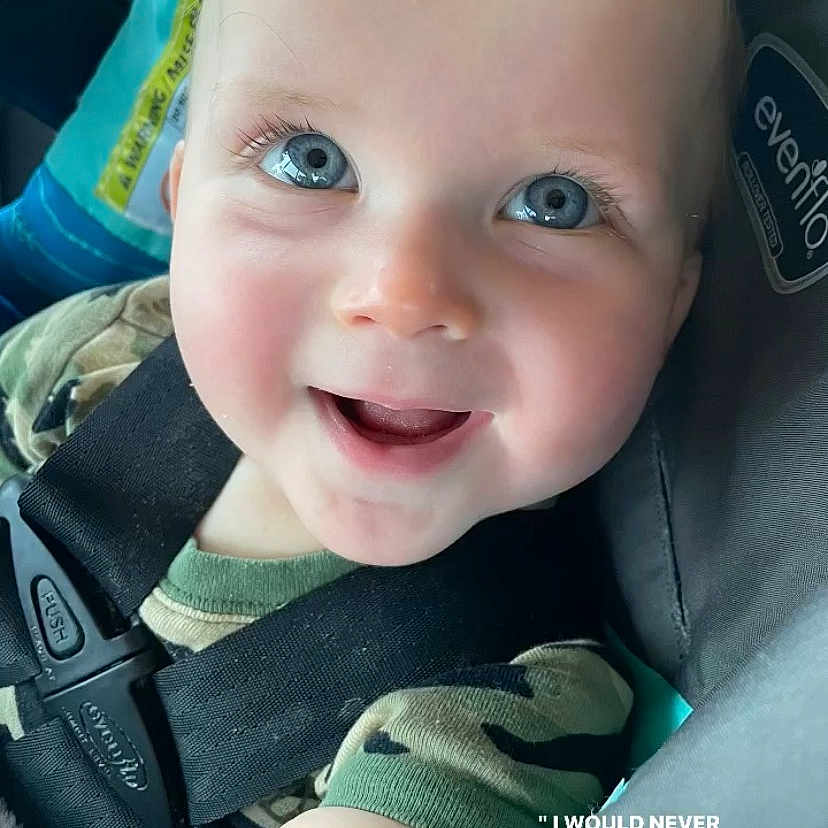 Sonny joined the competition — help win amazing prizes! baby, babylaughing, bodypart, clothing, coat, cushion, face, happy, head, homedecor, jacket, laughing, mouth, pants, person, photography, portrait, selfie, smile, teeth
