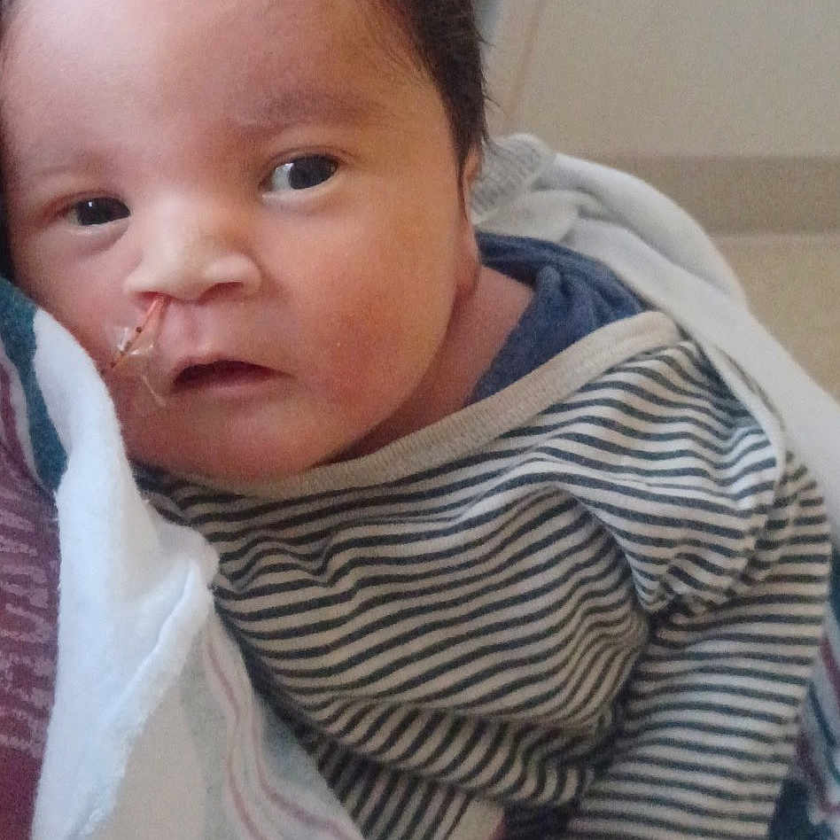 Liam is registered to the contest to win money with this photo: accessories, baby, bed, blanket, couch, cushion, earring, face, furniture, happy, head, homedecor, jewelry, linen, newborn, person, photography, portrait, quilt, towel