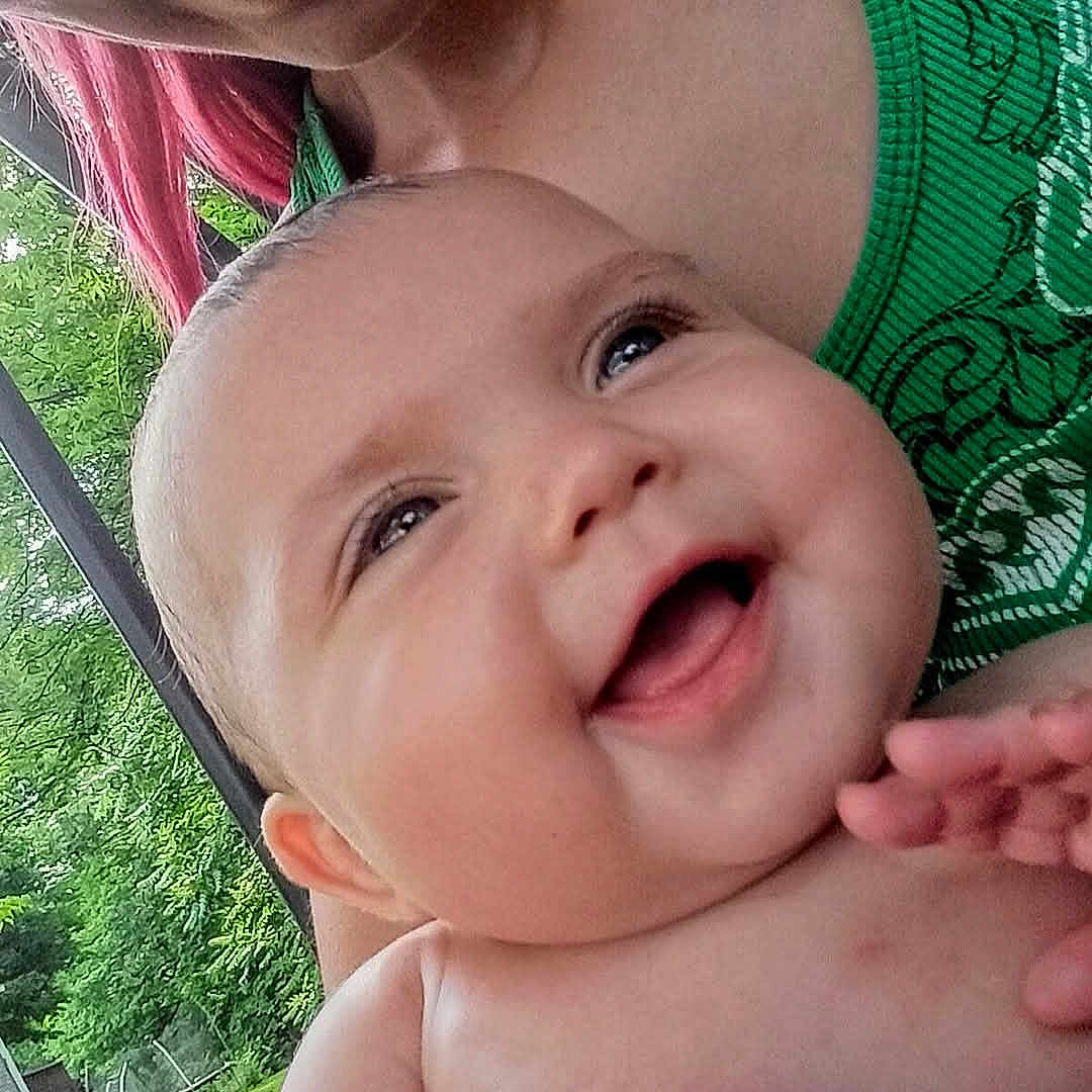 Ivy joined the competition — help win amazing prizes! baby, child, smiling, happy, person, face, skin, hand, outdoor, greenery, nature, tree, shirt, hair, closeup, portrait, joy, expression, infant, holding