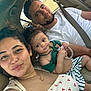 Mikayla joined the competition — help win amazing prizes! family, selfie, car_interior, man, woman, child, toddler, seatbelt, clothing, smile, curly_hair, toy, green_top, striped_shorts, jewelry, natural_light, happy, portrait, casual, closeup