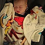 baby, blanket, car_seat, child, sleeping, cozy, infant, face, clothing, comfort, soft, rest, cute, child_seat, toddler, indoors, person, peaceful, head, wrapped