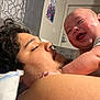 Micheal is registered to the contest to win money with this photo: baby, child, man, smiling, laughing, face, head, skin, hair, indoors, couch, pillow, clothing, person, family, bonding, happy, portrait, room, home