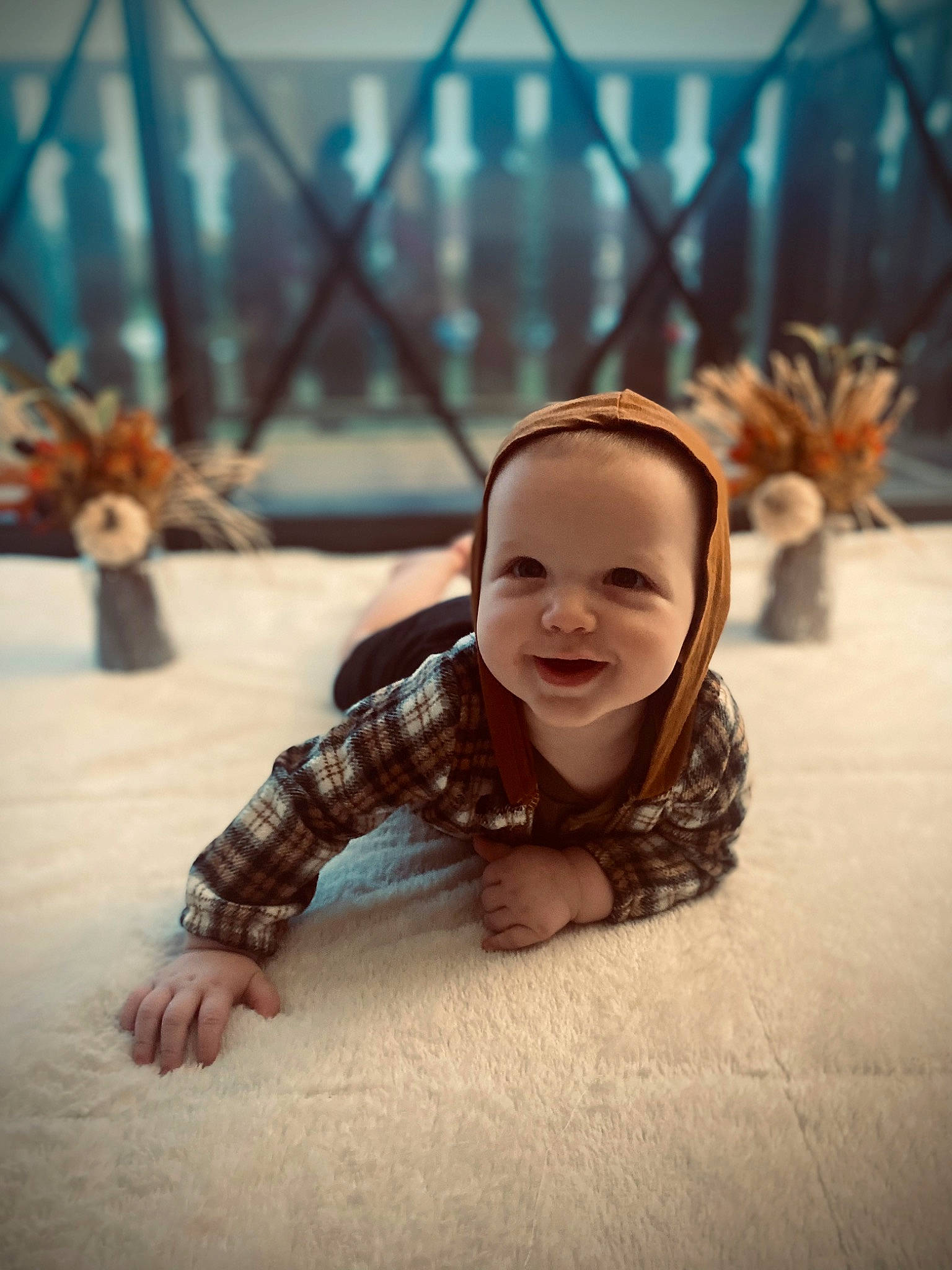 Brayden is registered to the contest to win money with this photo: baby, child, crawling, fence, flash_photography, floor, flooring, fun, grass, happy, joy, laugh, leisure, morning, pattern, people_in_nature, person, recreation, sitting, smile