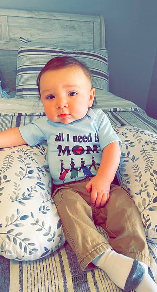 Lennon joined the competition — help win amazing prizes! baby, baby_toddler_clothing, cheek, clothing, comfort, electric_blue, eye, human_leg, iris, knee, lap, neck, pattern, person, shoulder, sitting, skin, sleeve, t_shirt, thigh