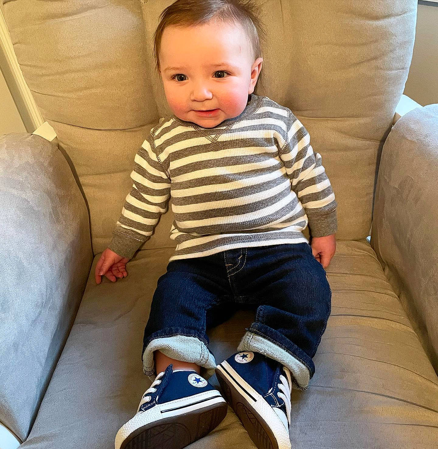Lennon is registered to the contest to win money with this photo: arm, baby_toddler_clothing, comfort, cool, finger, flooring, head, human_body, human_leg, knee, leg, neck, person, shoulder, sitting, sleeve, t_shirt, thigh, tints_and_shades, toddler