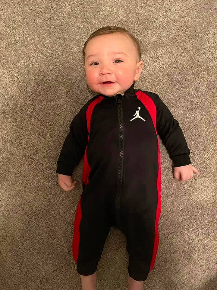 Lennon joined the competition — help win amazing prizes! baby, baby_toddler_clothing, cheek, child, eye, face, flooring, fun, happy, head, human_body, pattern, person, personal_protective_equipment, sleeve, smile, t_shirt, toddler