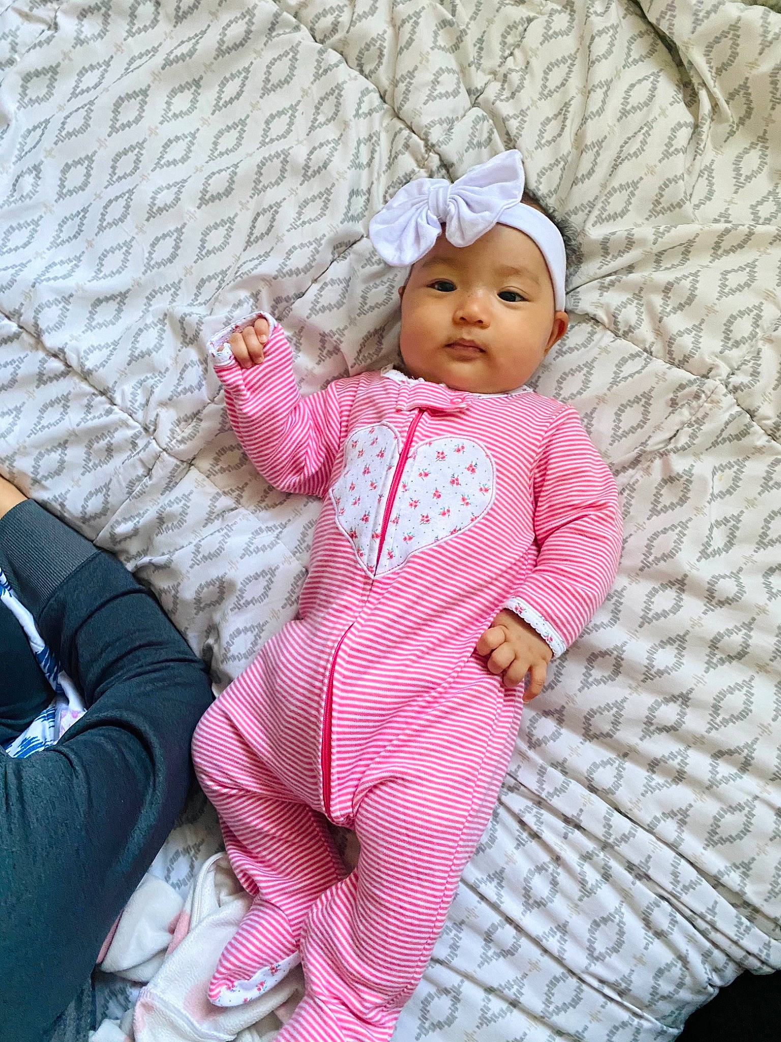 Deborah is registered to the contest to win money with this photo: active_pants, baby, baby_toddler_clothing, bonnet, comfort, headwear, nightwear, person, pink, sock, toddler