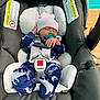 Devin joined the competition — help win amazing prizes! newborn, baby, car_seat, pacifier, hat, onesie, sleeping, infant, child, safety_harness, blue_clothing, animal_print, striped_hat, indoor, cute, resting, baby_gear, child_seat, fabric, comfort